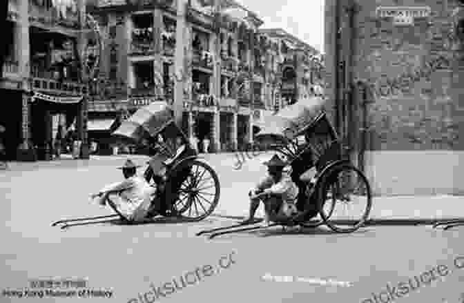 A Bustling Street Scene In Hong Kong In The 1930s, With Rickshaw Pullers, European Businessmen, And Traditional Chinese Opera Singers. A Voyage To War: An Englishman S Account Of Hong Kong 1936 41