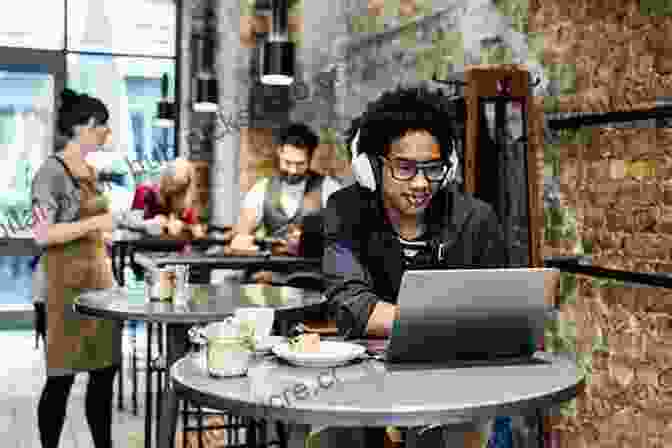 A Man Works On A Laptop In A Coffee Shop In Windsor. My Town: Faces Of Windsor