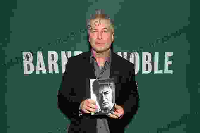 Alec Baldwin Holding A Copy Of His Memoir 'Nevertheless' Nevertheless: A Memoir Alec Baldwin