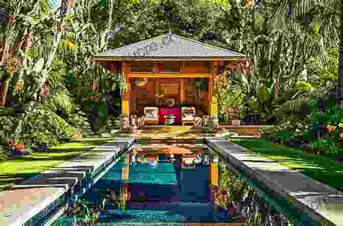 View Of The Lush Tropical Gardens Surrounding Colin McPhee's House In Bali, Showcasing The Abundance Of Vegetation And The Traditional Balinese Water Feature. House In Bali Colin McPhee